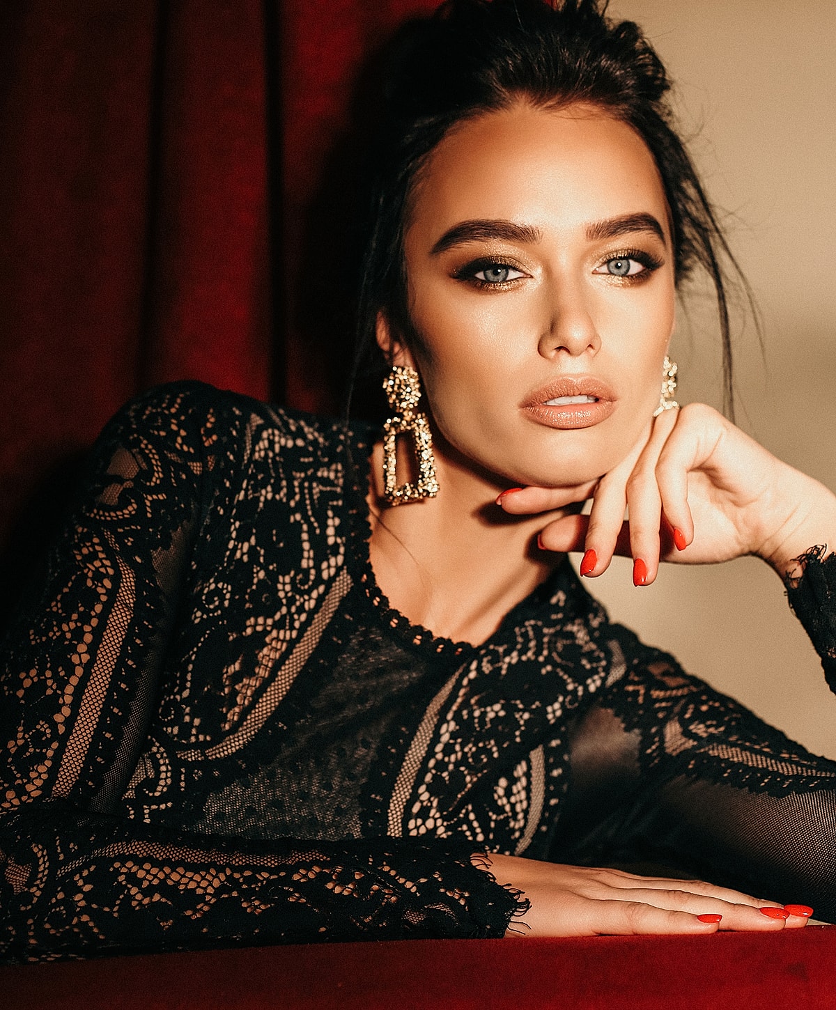 Elegant woman in lace top with bright eyes