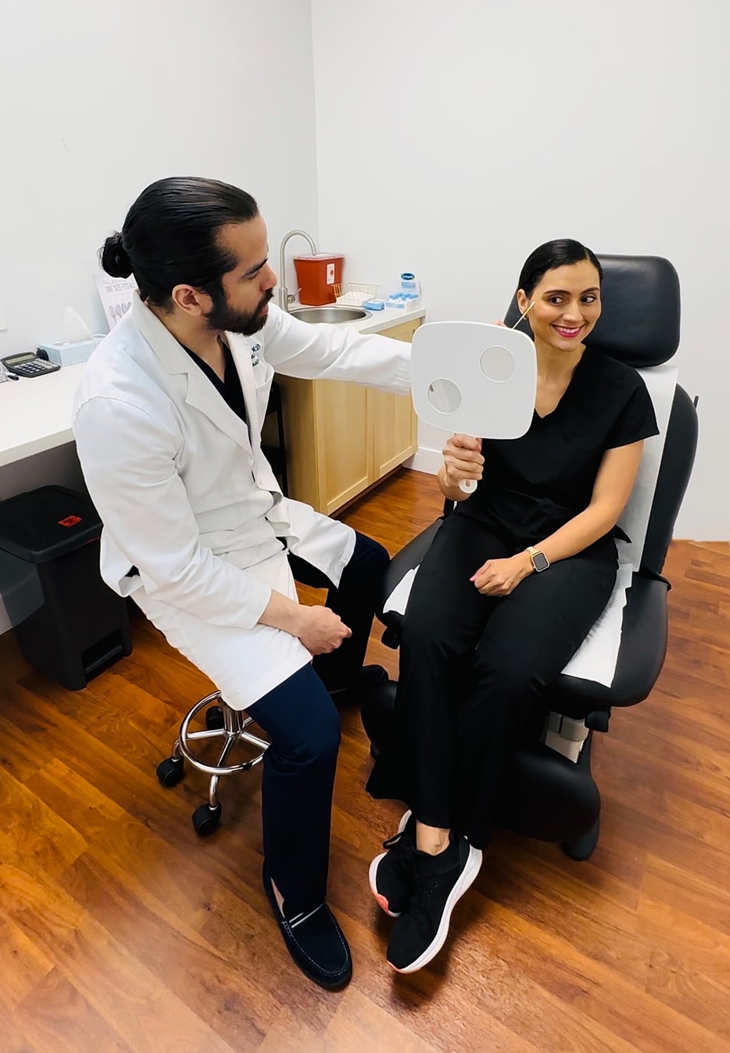 Cosmetic Dermatologist planning a laser combination treatment for patient